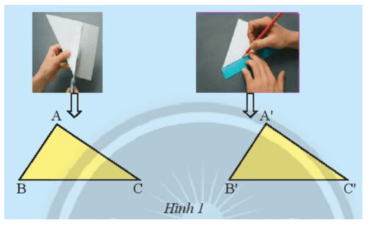 Dùng kéo cắt một tờ giấy thành hình tam giác ABC